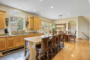 Kitchen featuring a sink, plenty of natural light, recessed lighting, and a center island