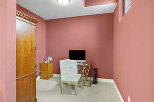 Office space with carpet and baseboards
