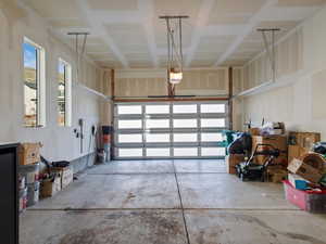 Garage featuring a garage door opener