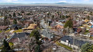 Birds eye view of property with a mountain view and a residential view