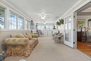 Sunroom / solarium featuring ornamental molding