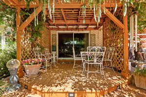 View of patio / terrace featuring a pergola and a wooden deck