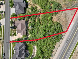 Aerial perspective of suburban area featuring property parcel outlined