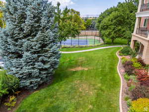 View of yard featuring fence and a mountain view