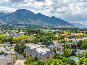 Drone / aerial view featuring a residential view and a mountain view