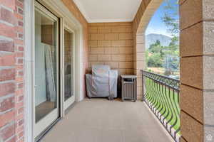 Balcony featuring grilling area and a mountain view
