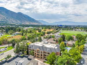 Birds eye view of property with a residential view and a mountain view