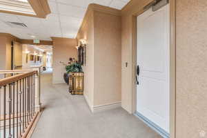 Property entrance featuring a balcony and visible vents