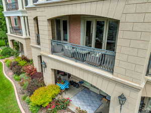 View of exterior entry with a balcony