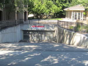 Exterior space with fence and concrete driveway