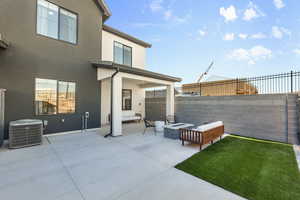 View of patio / terrace with central air condition unit and fence