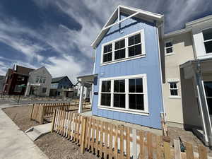 View of property exterior featuring a residential view and board and batten siding