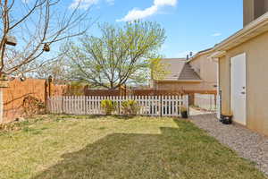 View of back yard featuring fence, private yard