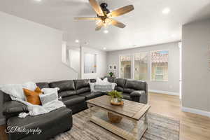 Living room with recessed lighting, baseboards, light wood finished floors, and ceiling fan