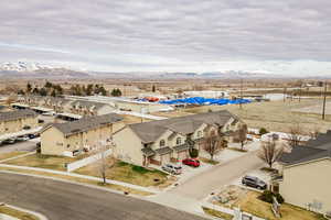 Birds eye view of property with a residential view and a mountain view