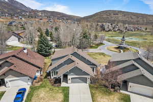 Drone / aerial view featuring a residential view and a mountain view