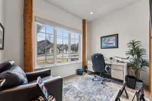 Office space with baseboards, wood finished floors, and recessed lighting