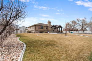 View of yard featuring a gazebo, fence private yard, and a patio area