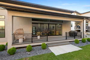 Rear view of house with stucco siding