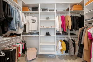 Spacious closet featuring visible vents