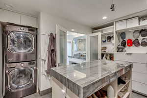 Laundry area with stacked washer / dryer and laundry area