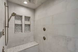 Bathroom featuring a tile shower