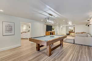 Game room featuring baseboards, billiards, light wood-style floors, and recessed lighting