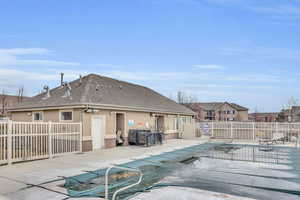 Pool featuring fence and a patio