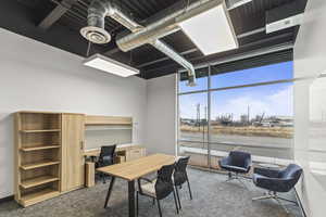 Carpeted office with expansive windows