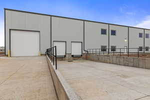 Exterior space featuring an outdoor structure and fence