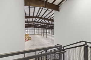 Interior space with lofted ceiling and concrete floors