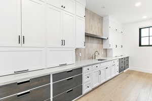 Butler pantry with additional cabinets, storage, and prep space