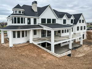 Rear view of home and covered deck and patio