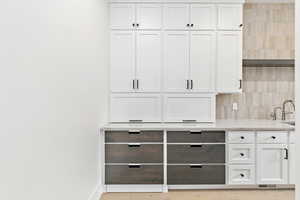 Butler pantry with hidden "Costco door" access to the garage