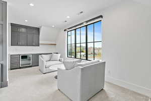 Sitting area in master bedroom with private fridge