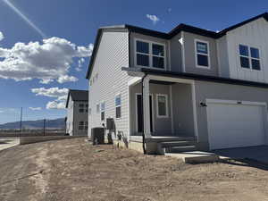 James Hardie Cement board and batten siding, a garage, and a mountain view