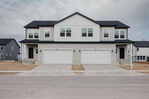 Front of Twin home Covered patio , all Landscaping will be completed and  YARDS CAN BE FENCED