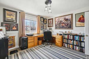 Office area with wood finished floors