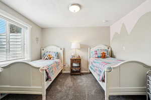 Carpeted bedroom with baseboards