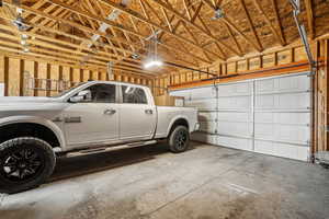 Garage featuring a garage door opener