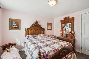 Carpeted bedroom featuring baseboards