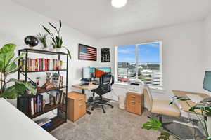 Carpeted office featuring baseboards
