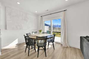 Dining space featuring baseboards, visible vents, recessed lighting, and light wood finished floors