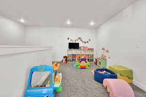 Game room featuring baseboards, recessed lighting, and carpet flooring