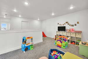 Game room with baseboards, recessed lighting, and carpet