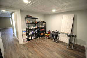 Interior space featuring recessed lighting, baseboards, and dark wood-type flooring