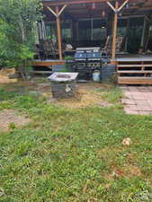 View of yard with an outdoor fire pit