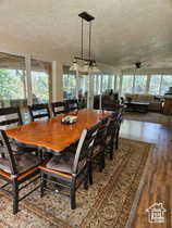 Dining room featuring a textured ceiling and lofted ceiling