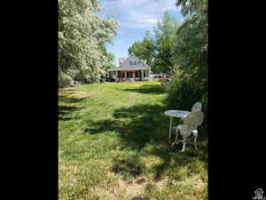 View of yard with a sunroom