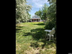 View of yard featuring a sunroom